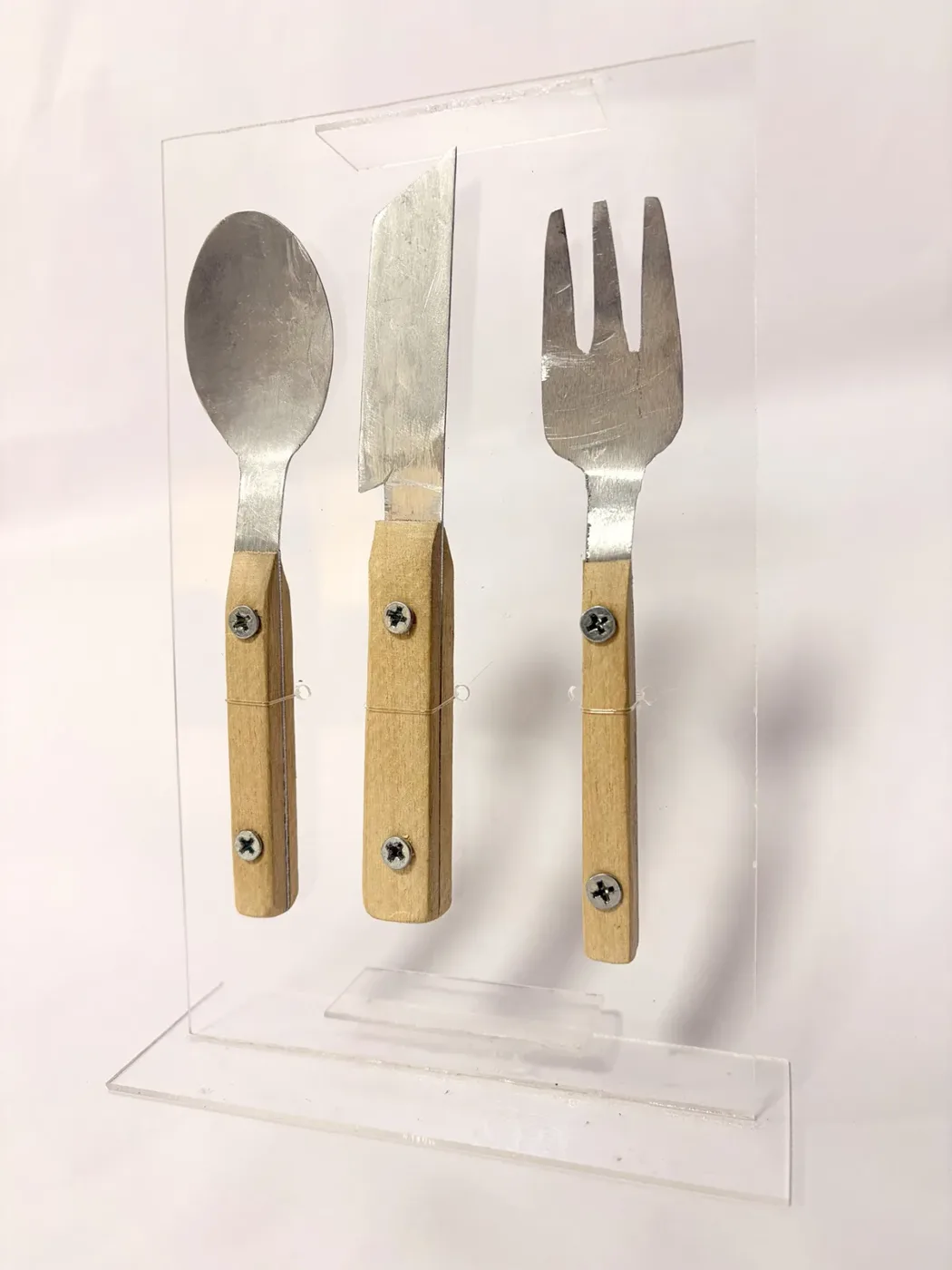The set standing in its glass frame