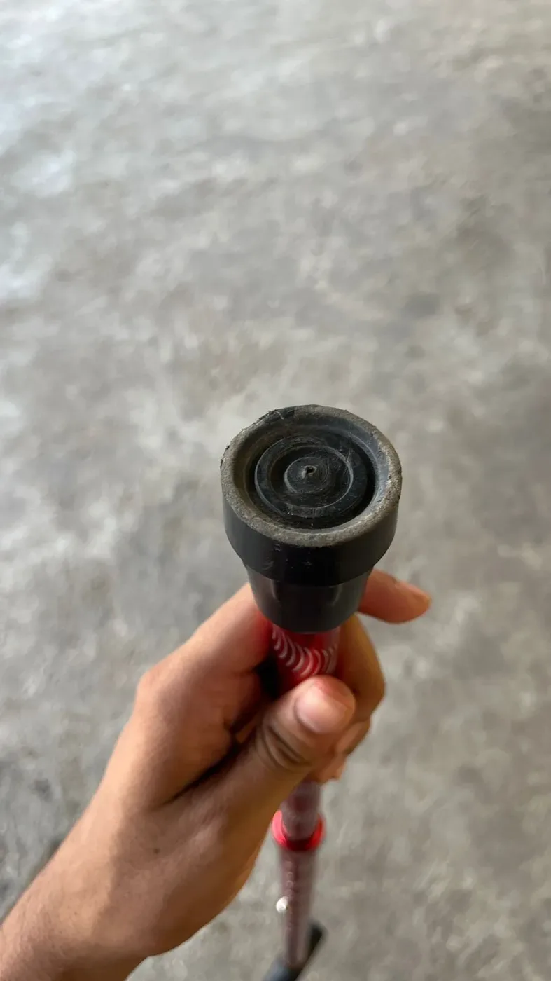 Worn rubber tip of a cane