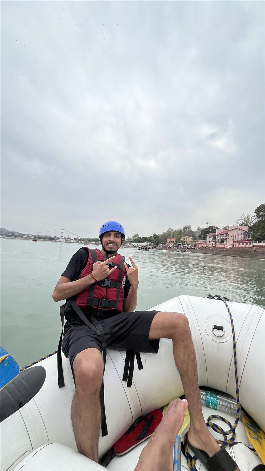Pradyumn river rafting in a helmet and life jacket