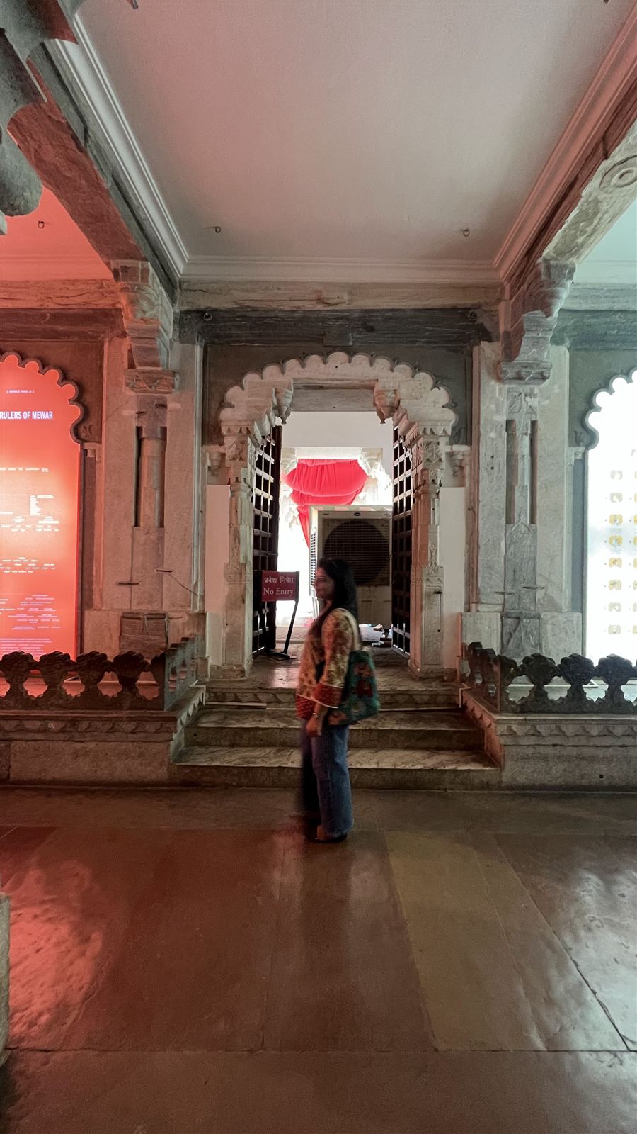 Visitor in a palace corridor